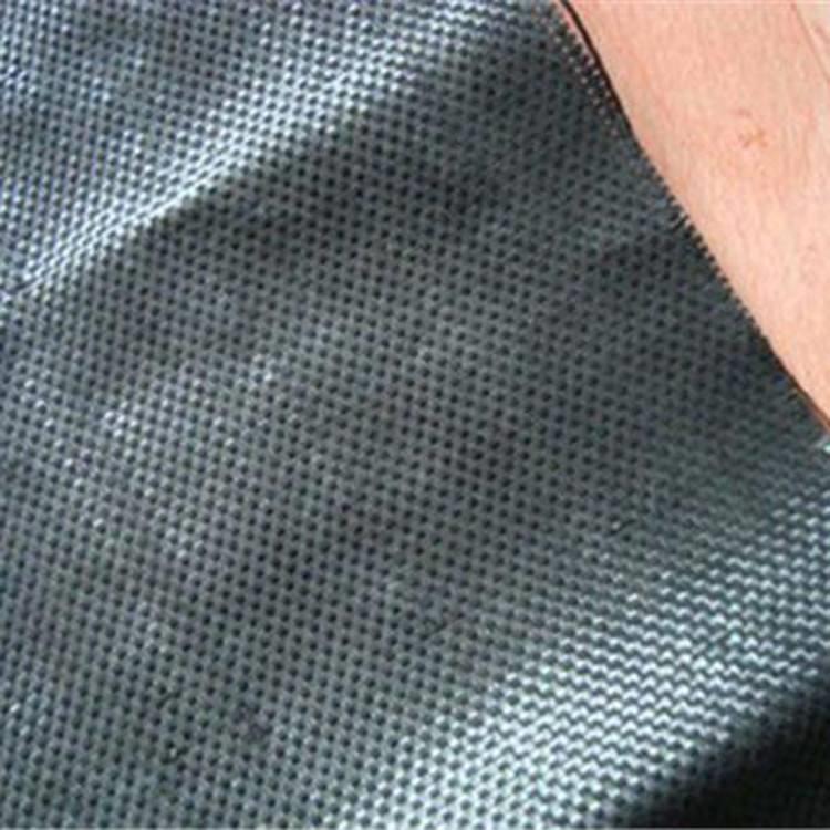 Woven grass control geotextile