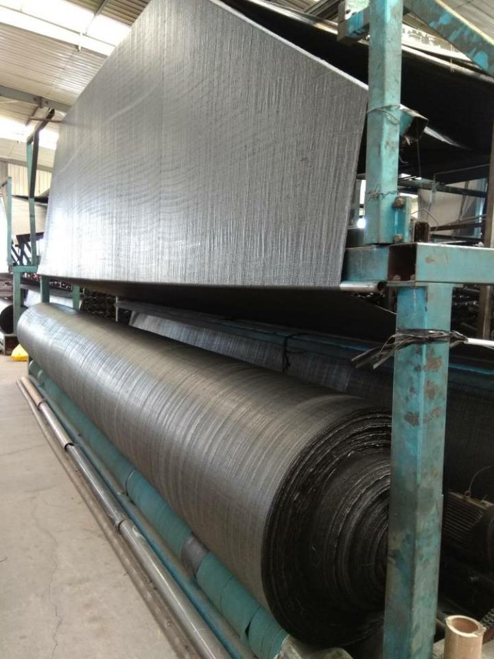 Woven grass control geotextile