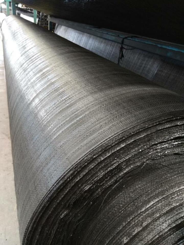 Woven grass control geotextile