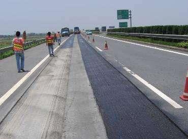 Woven grass control geotextile